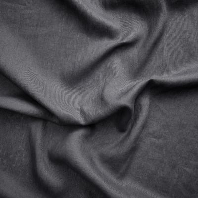 Two gray linen curtains hang side by side, featuring simple, dark color and natural texture.