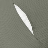 Close-up of a grey-green cushion cover with an envelope closure, showcasing its textured waffle pattern.