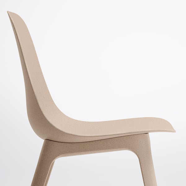 Minimalist chair with smooth, curved back and seat, made from durable wood plastic composite, shown in neutral beige.