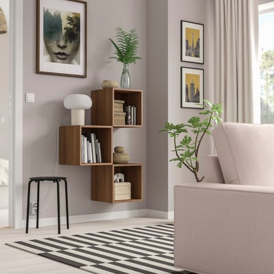 Modern living room with EKET wooden wall shelf, books, and decorations.