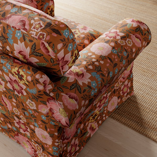 Floral-patterned armchair detail; thick, comfy cushions; easy-clean cover.