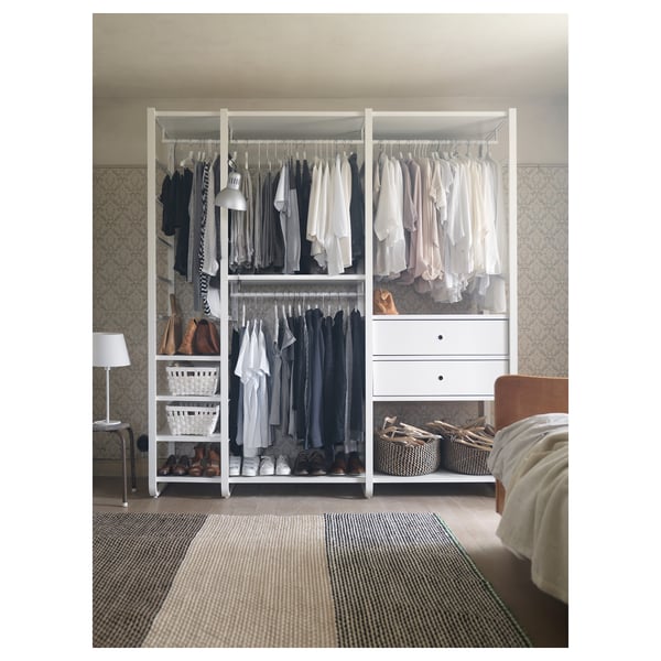 ELVARLI storage: white, open, shelves & racks, baskets & drawers, striped rug, patterned wallpaper.