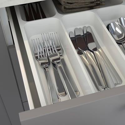 Silverware organizer with forks, knives, and spoons, part of ENHET kitchen series.