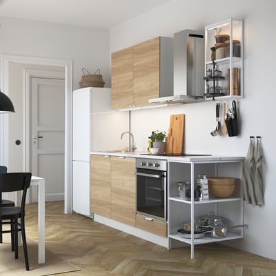 Modern kitchen with wooden cabinets, stainless steel appliances, and open shelves.