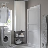 Modern laundry room with ENHET cabinets, washing machine, and garment rack.