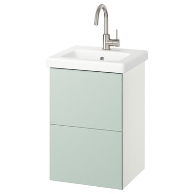 ENHET pale green 2-drawer sink cabinet, wall-mounted with ceramic basin, chrome faucet, sleek modern design.