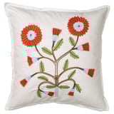 White square cushion with hand-embroidered orange and blue flowers, green leaves, on soft cotton.