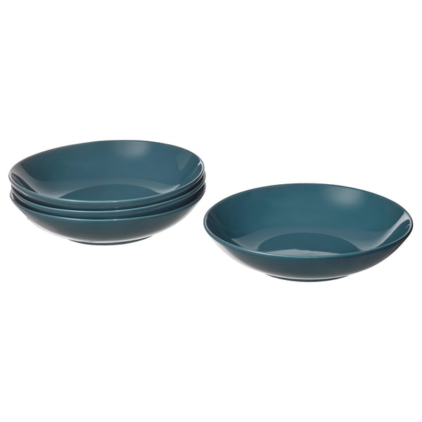Four deep blue stoneware bowls, three stacked, one separate, with simple, modern design.
