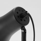 Black adjustable desk lamp close-up, quality steel construction with multiple ventilation holes.
