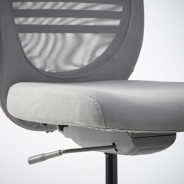 Ergonomic office chair with mesh back and seat; adjustable, lockable tilt, and rubber-coated castors.
