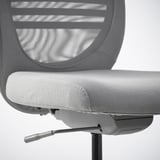 Ergonomic office chair with mesh back and seat; adjustable, lockable tilt, and rubber-coated castors.