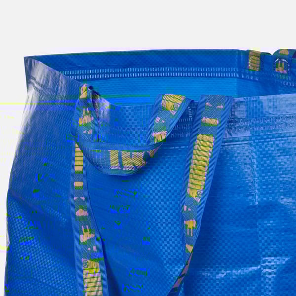 Blue reusable shopping bag with strong yellow straps, designed to carry heavy loads, foldable, and eco-friendly with recycled material.