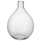 Clear glass vase, rounded shape, handcrafted, single stem opening.