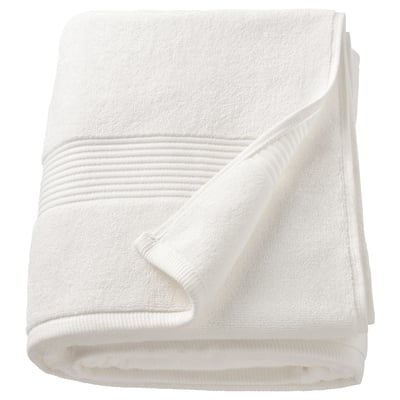 A white FREDRIKSJÖN towel, thick and soft, made of 100% cotton, folded neatly.