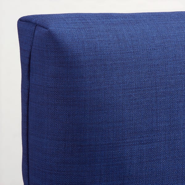 Blue upholstered cushion, textured fabric, firm yet soft. Ideal for comfort.