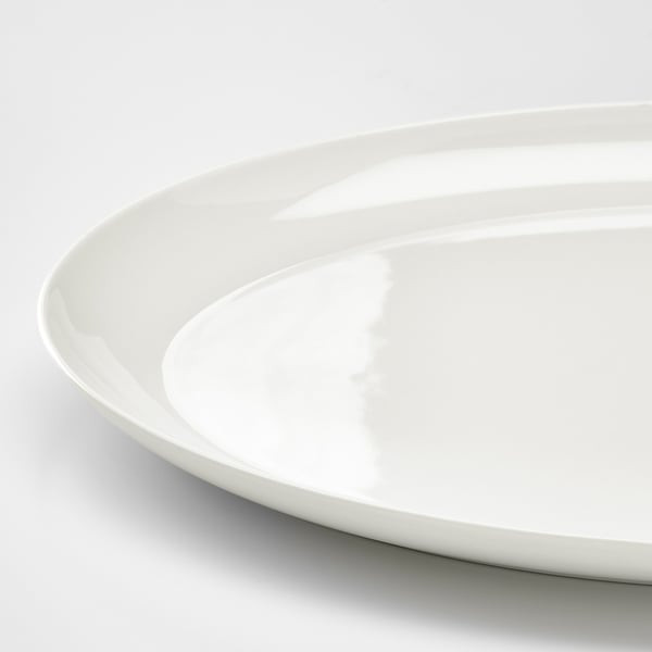 Smooth, pristine white dish with sleek, rounded edges. Fine china material, translucent and durable.
