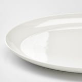 Smooth, pristine white dish with sleek, rounded edges. Fine china material, translucent and durable.