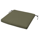 Green outdoor chair cushion, rectangular with ties, made from recycled materials.