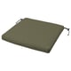 Green outdoor chair cushion, rectangular with ties, made from recycled materials.