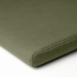Green outdoor cushion close-up; smooth fabric, even stitching, quality design.