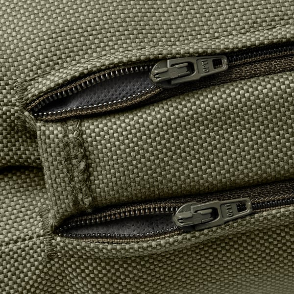 Close-up of zipper on recycled polyester cushion cover. Zippers smooth, sturdy, quality feels durable.