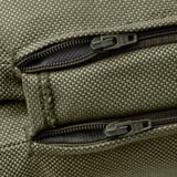 Close-up of zipper on recycled polyester cushion cover. Zippers smooth, sturdy, quality feels durable.