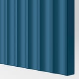 A close-up of a deep-blue door with a smooth, milled surface, showcasing high-quality craftsmanship and a sophisticated look.
