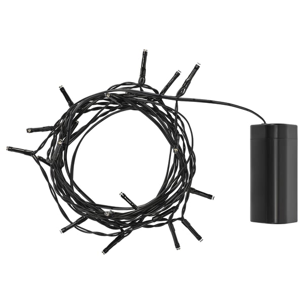 Black outdoor light set with sensor. Small cylindrical battery box.