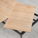 Extending dining table with aluminum legs. Hides extra leaf underneath for easy access.