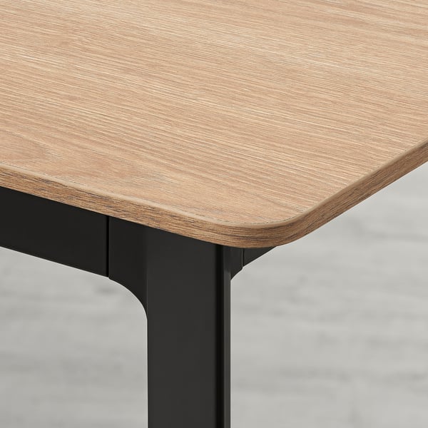 Sleek, extendable dining table with smooth, realistic wood-textured top and sturdy, modern metal legs.