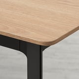 Sleek, extendable dining table with smooth, realistic wood-textured top and sturdy, modern metal legs.