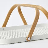 White metal tray with wooden handles. Sleek, modern design. Handles folded flat against tray.