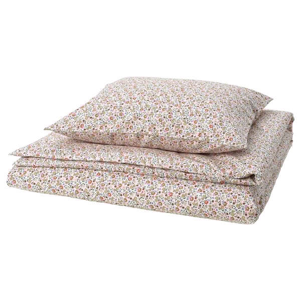 Folded floral bedding set, light colors. Tiny flowers, cotton/viscose mix. Soft, breathable, fresh design.