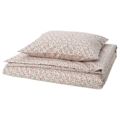 Folded floral bedding set, light colors. Tiny flowers, cotton/viscose mix. Soft, breathable, fresh design.