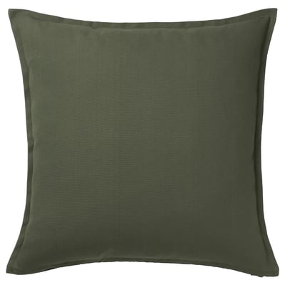 A GURLI square throw pillow in deep green, made of cotton from sustainable sources, with a hidden zipper closure and a simple, solid design.