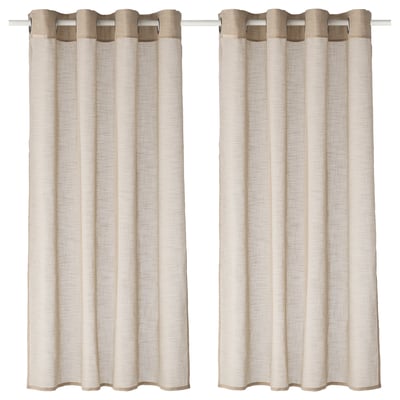 Two light beige sheer curtains hang side by side, featuring simple eyelet design for a modern look.