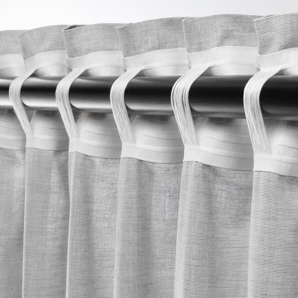 Blackout curtains with rod pocket heading, providing privacy and light control.