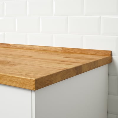 A wooden countertop end corner, designed to prevent water from seeping between wall and worktop, providing a neat finish.