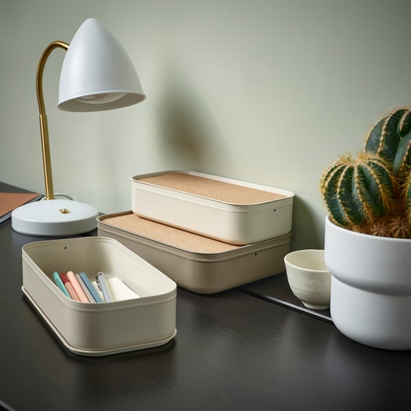 Cream HARVMATTA desk box with pens, lamp, and cactus.