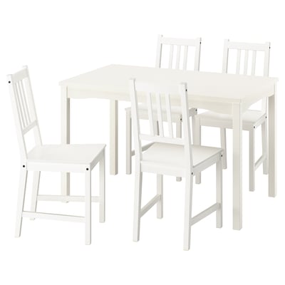 A white HAUGA dining set with a table and four chairs, made of solid wood, with a simple and traditional design.