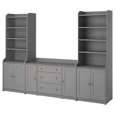 A gray HAUGA storage set including two tall bookcases and a wide sideboard with drawers and cabinets.