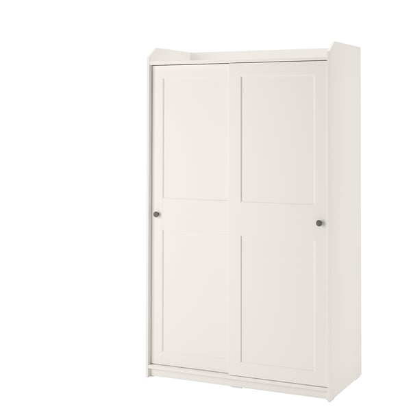 A white HAUGA wardrobe with sliding doors, made of particleboard, fiberboard, and acrylic paint. It has a rectangular shape with a traditional design.