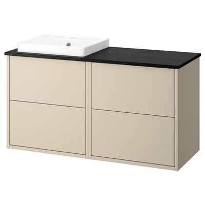 Light beige HAVBÄCK bathroom vanity with black countertop and white basin.