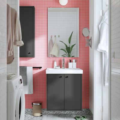 Modern bathroom with pink tiles, grey HAVBÄCK vanity, white sink, and mirror.