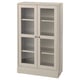 A light-colored HAVSTA wooden cabinet with glass doors, displaying a rustic yet modern design.