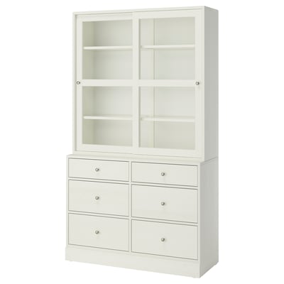 HAVSTA: white, wooden cabinet with six drawers and glass sliding doors, showcasing a rustic, elegant design.