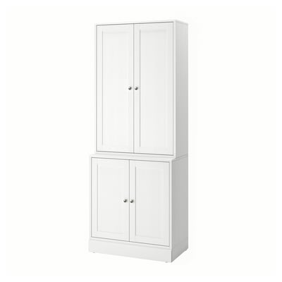 White wooden storage cabinet with two sections and doors, simple scandinavian design.