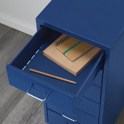 Blue drawer unit with pencil and notepad on top drawer, ready for use.