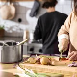 Person chopping veggies.