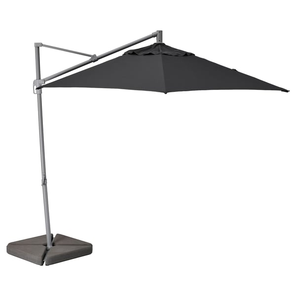 Black cantilever umbrella HISSÖ with aluminum frame, recycled polyester canopy, and concrete base.